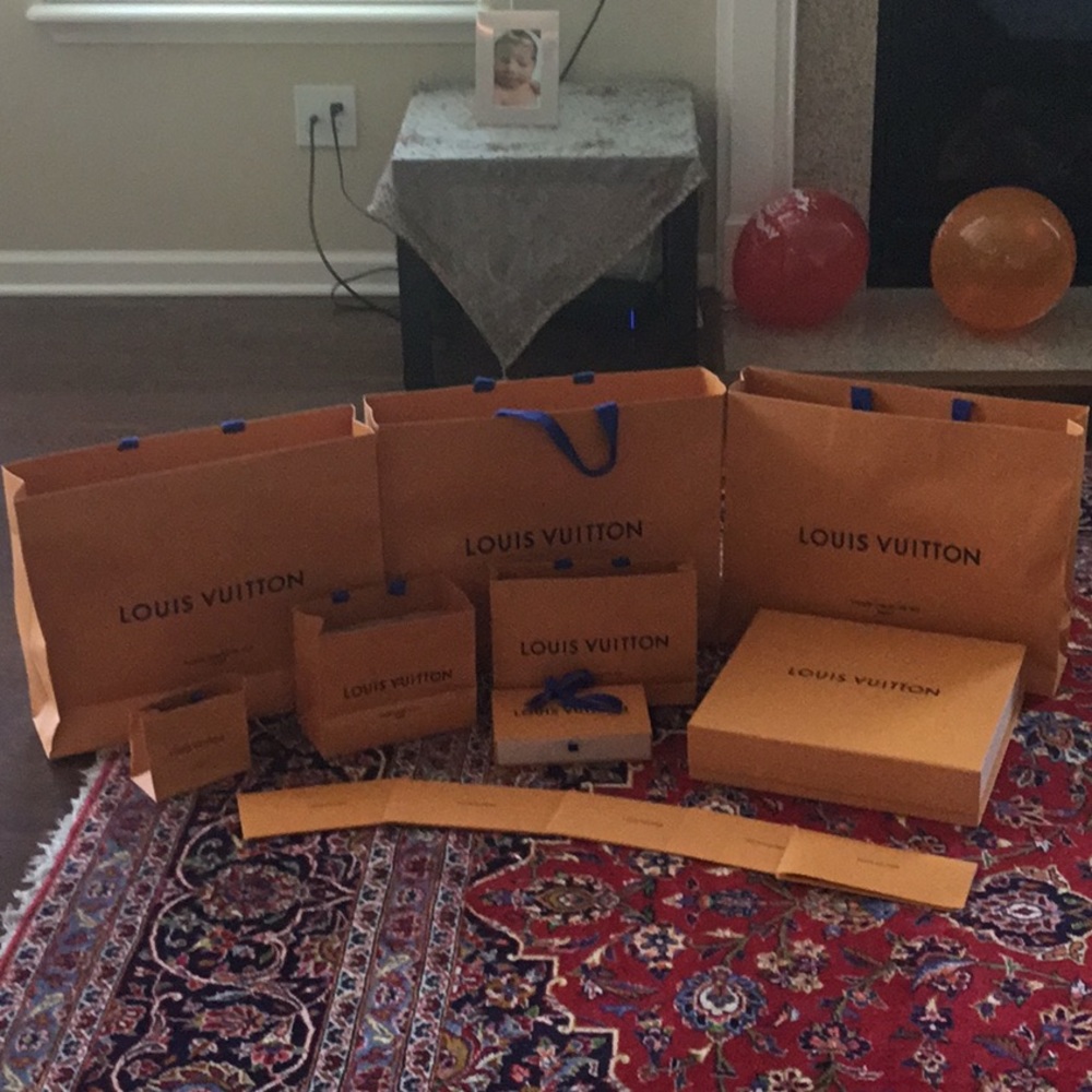 Louis Vuitton boxes and shopping bags